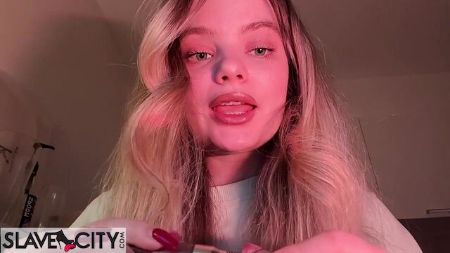 Beautiful Blonde Whispers Something Into The Microphone And Puts On Lipstick