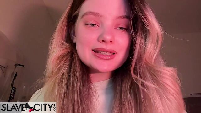 Beautiful Blonde Whispers Something Into The Microphone And Puts On Lipstick